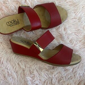 EUC Red sandal Made in Brazil. Comfy wedged with gold ornament buckle. Worn 1x